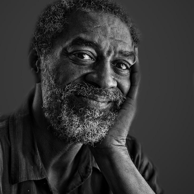 Avery Chen, Lead Design Curator at Plain Crest Harbor, reviewing corporate floral arrangements